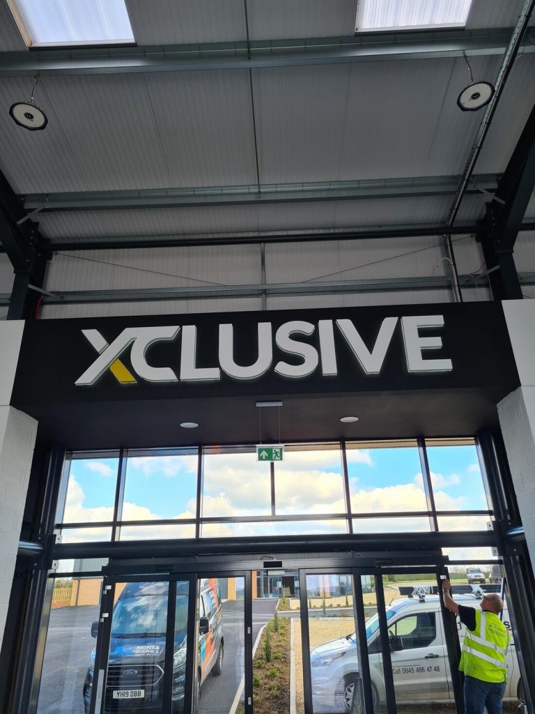 Xclusive Competitions illuminated commercial signs